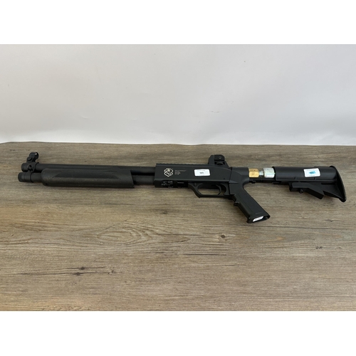 565 - A Real Action Marker B-series B07J0180 cal. 68 co2 powered pump action paint ball shotgun