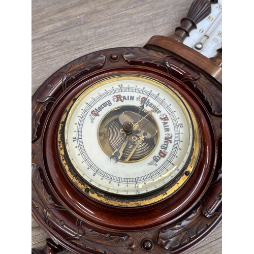 573 - A 19th century carved mahogany aneroid barometer - approx. 60cm high x 23cm wide