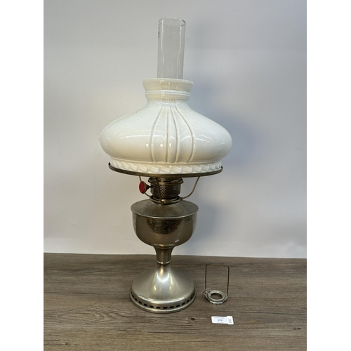 575 - A mid 20th century chrome plated oil lamp with opaline glass shade