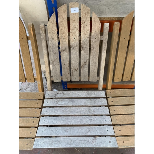 886 - Three teak folding garden chairs