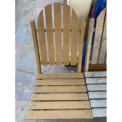 886 - Three teak folding garden chairs