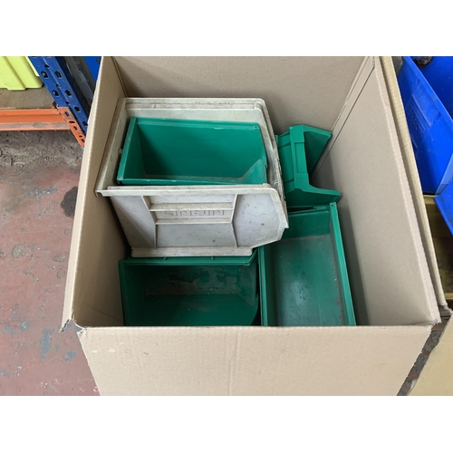 889 - A collection of plastic storage bins