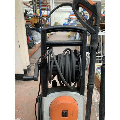 902 - A Stihl RE 127 Plus electric pressure washer with Stihl RA 101 surface cleaner attachment