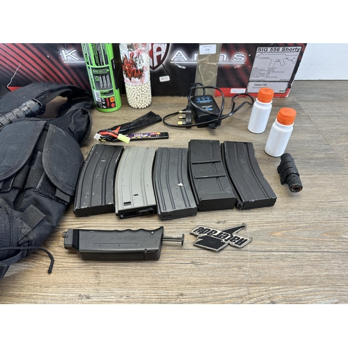 578 - A quantity of airsoft equipment to include boxed King Arms SIG 556 Shorty, SIG Arms magazines, S.W.A... 