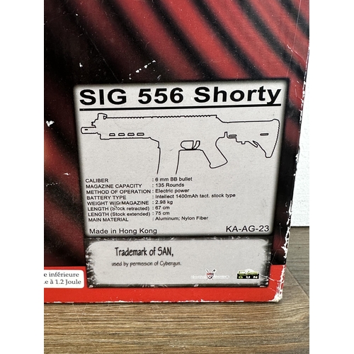 578 - A quantity of airsoft equipment to include boxed King Arms SIG 556 Shorty, SIG Arms magazines, S.W.A... 