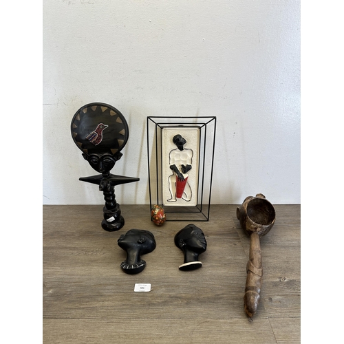 586 - Six items to include a carved African Ashanti fertility figurine, mid 20th century African chalkware... 