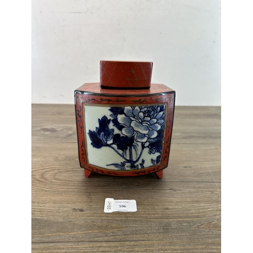 596 - A Chinese red lacquered and hand-painted tea caddy with 19th century blue and white porcelain plaque... 