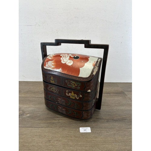 597 - A Chinese red lacquered and hand-painted four section wedding basket with porcelain hand-painted top... 