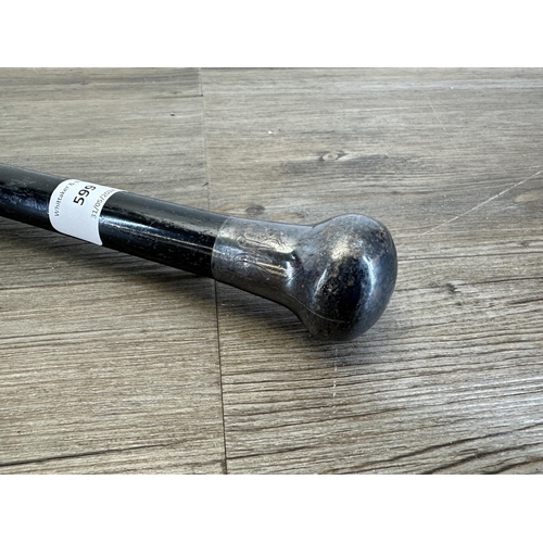 599 - A late 19th/early 20th century ebonized walking cane with hallmarked London silver top - approx. 90c... 