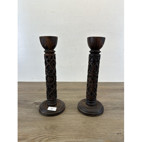 604 - A pair of Past Times carved hardwood candlesticks - approx. 33.5cm high