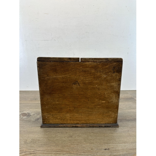 605 - An early 20th century oak stationary cabinet - approx. 27cm high x 29cm wide x 17cm deep