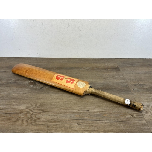 608 - A vintage Stuart Surridge & Co. Ltd. cricket bat - approx. 84cm long