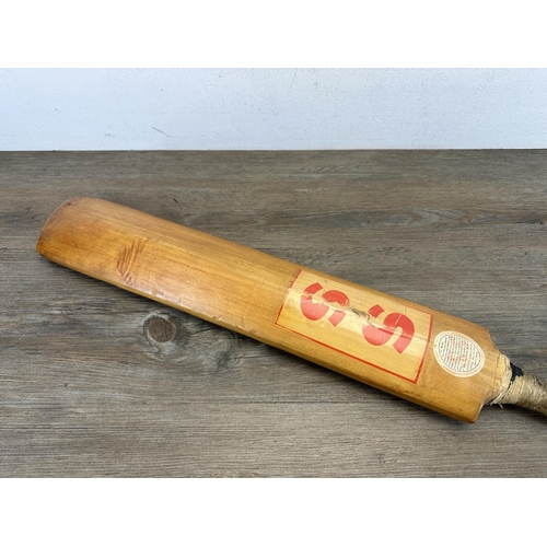 608 - A vintage Stuart Surridge & Co. Ltd. cricket bat - approx. 84cm long