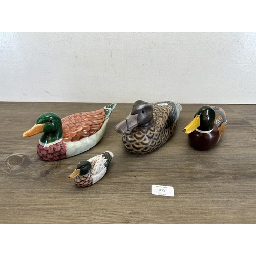 612 - Four hand-painted decoy ducks, three wooden and one terracotta