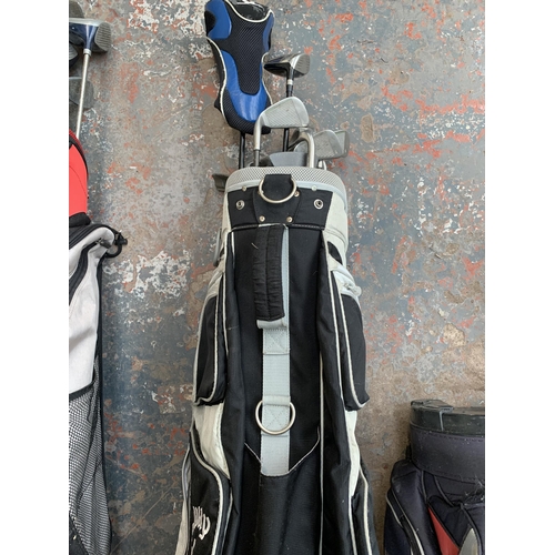 867 - Three golf bags containing golf clubs to include Wilson, Fazer etc.