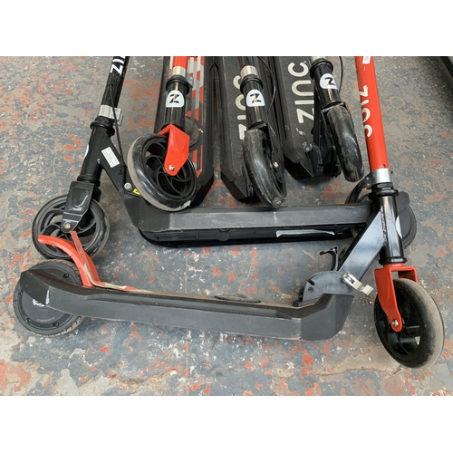 876 - Five Zinc electric scooters