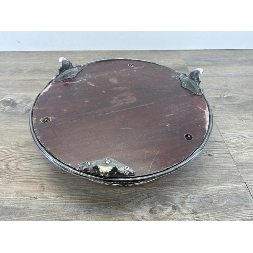 403 - A 19th century silver plate and mirrored glass circular tri-footed cake stand - approx.14cm high x 4... 