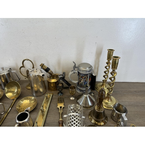 406 - A collection of antique and later metalware to include brass beehive candlestick - approx. 36cm high... 