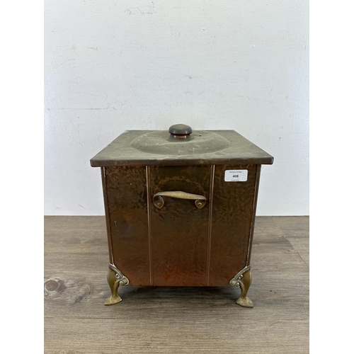 408 - An Art Nouveau copper and brass coal box - approx. 31cm high x 30cm wide