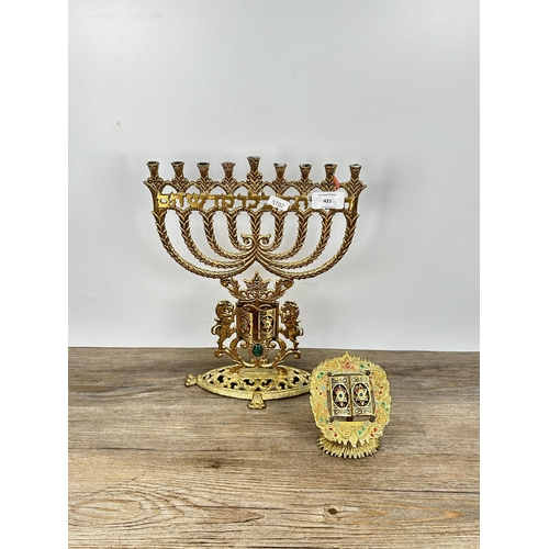 421 - Two cast brass and enamel religious ornaments, one Menorah - approx. 34.5cm high and one Ten Command... 