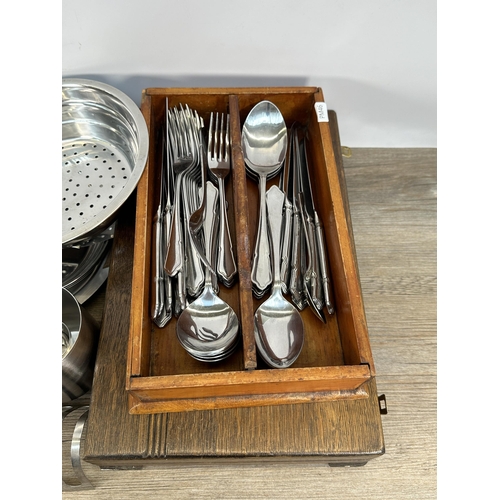 422 - A collection of metalware to include vintage catering equipment, loose cutlery, 1930s oak cased Watf... 