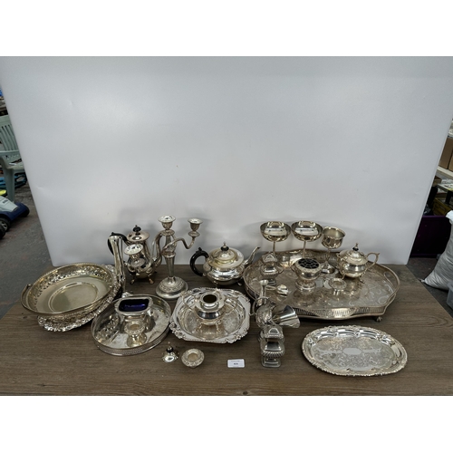 423 - A collection of 19th century and later EPNS and silver plated ware to include candelabras, three pie... 