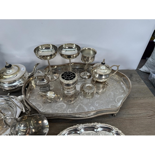 423 - A collection of 19th century and later EPNS and silver plated ware to include candelabras, three pie... 