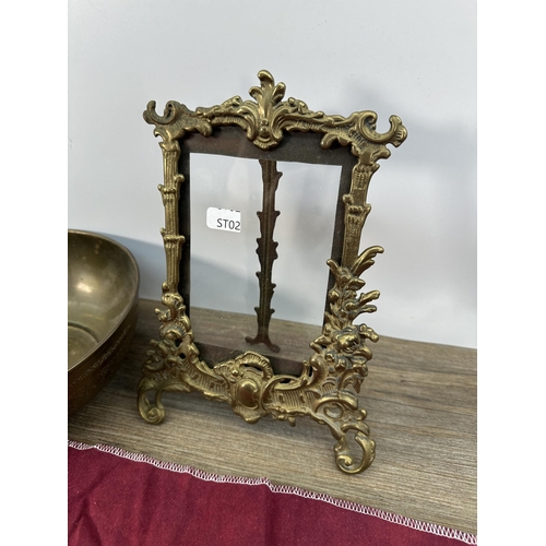 425 - A collection of metalware to include Rococo style brass photo frame - approx. 22cm high x 16cm wide,... 