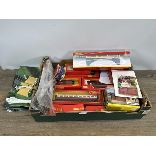 437 - A collection of mostly boxed Hornby model railway accessories to include passenger coaches, river br... 