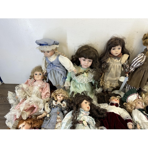 438 - A collection of porcelain headed dolls