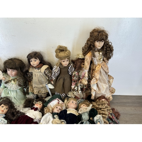 438 - A collection of porcelain headed dolls