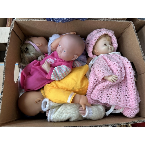 447 - Two boxes containing a collection of vintage plastic dolls and accessories to include Sum Sum, Tiny ... 