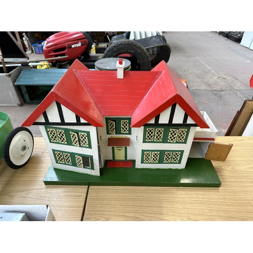 455 - A 1960s scratch built wooden, metal and hand-painted two story doll's house - approx. 42cm high x 72... 