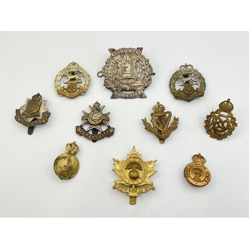 2201 - Ten military cap badges