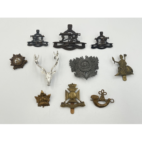 2203 - Ten military cap badges