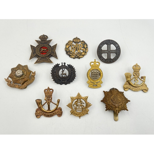 2205 - Ten military cap badges