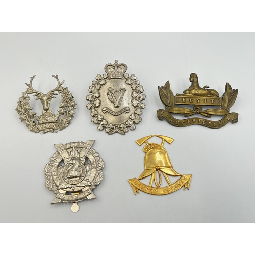 2209 - Five military cap badges