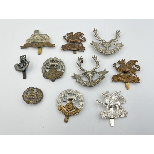 2216 - Ten military cap badges