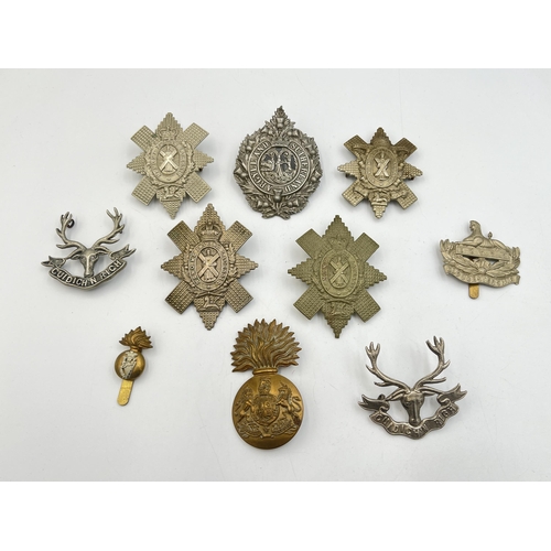 2218 - Ten military cap badges