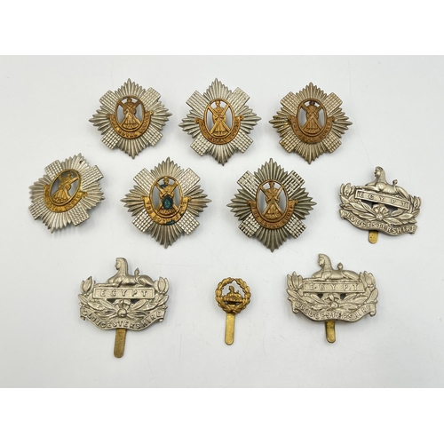 2219 - Ten military cap badges