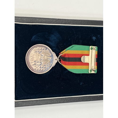 2266 - A boxed Zimbabwe Independence 1980 silver medal