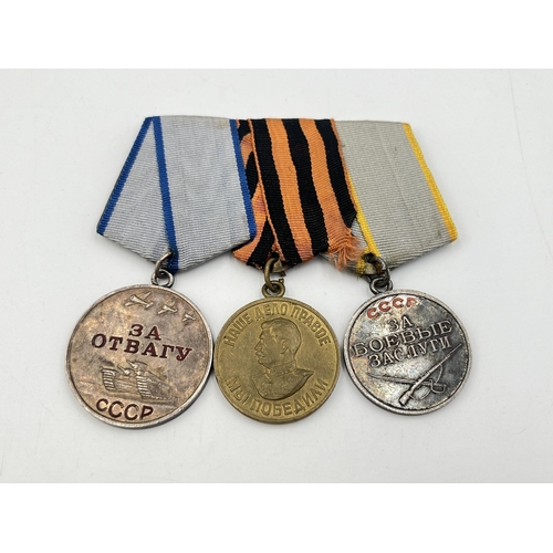 2269 - A WWII Russian medal trio, one numbered 2026739 and one numbered 2326152