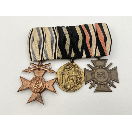 2272 - A WWI German medal trio comprising Bavarian Merit Cross, Legion of Honour and The Honour Cross