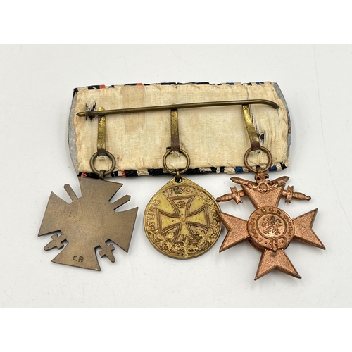 2272 - A WWI German medal trio comprising Bavarian Merit Cross, Legion of Honour and The Honour Cross