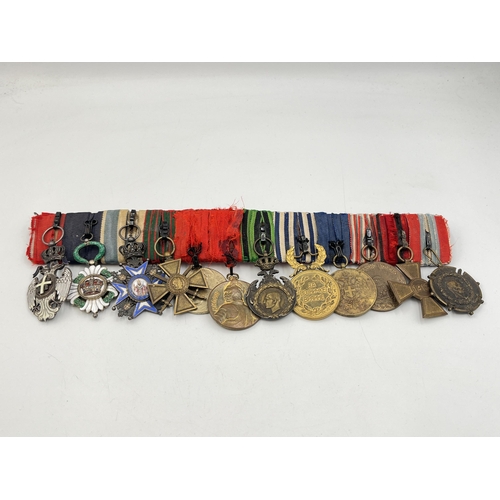 2274 - A WWI and later twelve medal group to include Serbian Order Of The White Eagle, French Croix De Guer... 