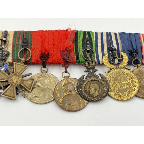 2274 - A WWI and later twelve medal group to include Serbian Order Of The White Eagle, French Croix De Guer... 