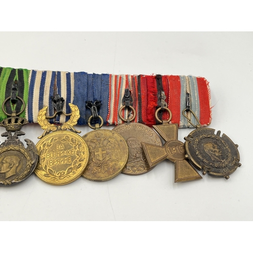 2274 - A WWI and later twelve medal group to include Serbian Order Of The White Eagle, French Croix De Guer... 