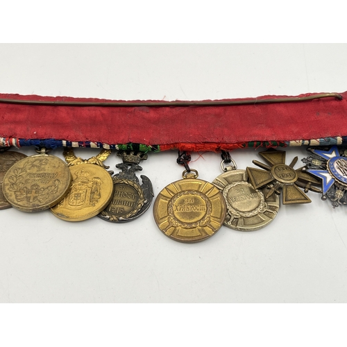 2274 - A WWI and later twelve medal group to include Serbian Order Of The White Eagle, French Croix De Guer... 