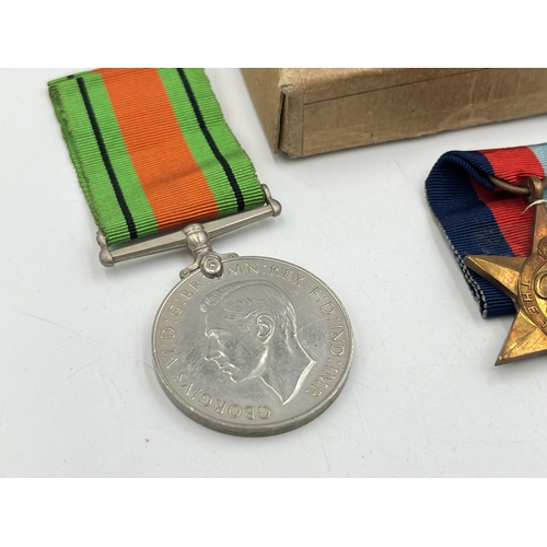 2282 - A boxed WWII medal trio, The Italy Star, Defence and The 1939-1945 Star