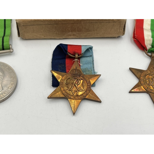 2282 - A boxed WWII medal trio, The Italy Star, Defence and The 1939-1945 Star